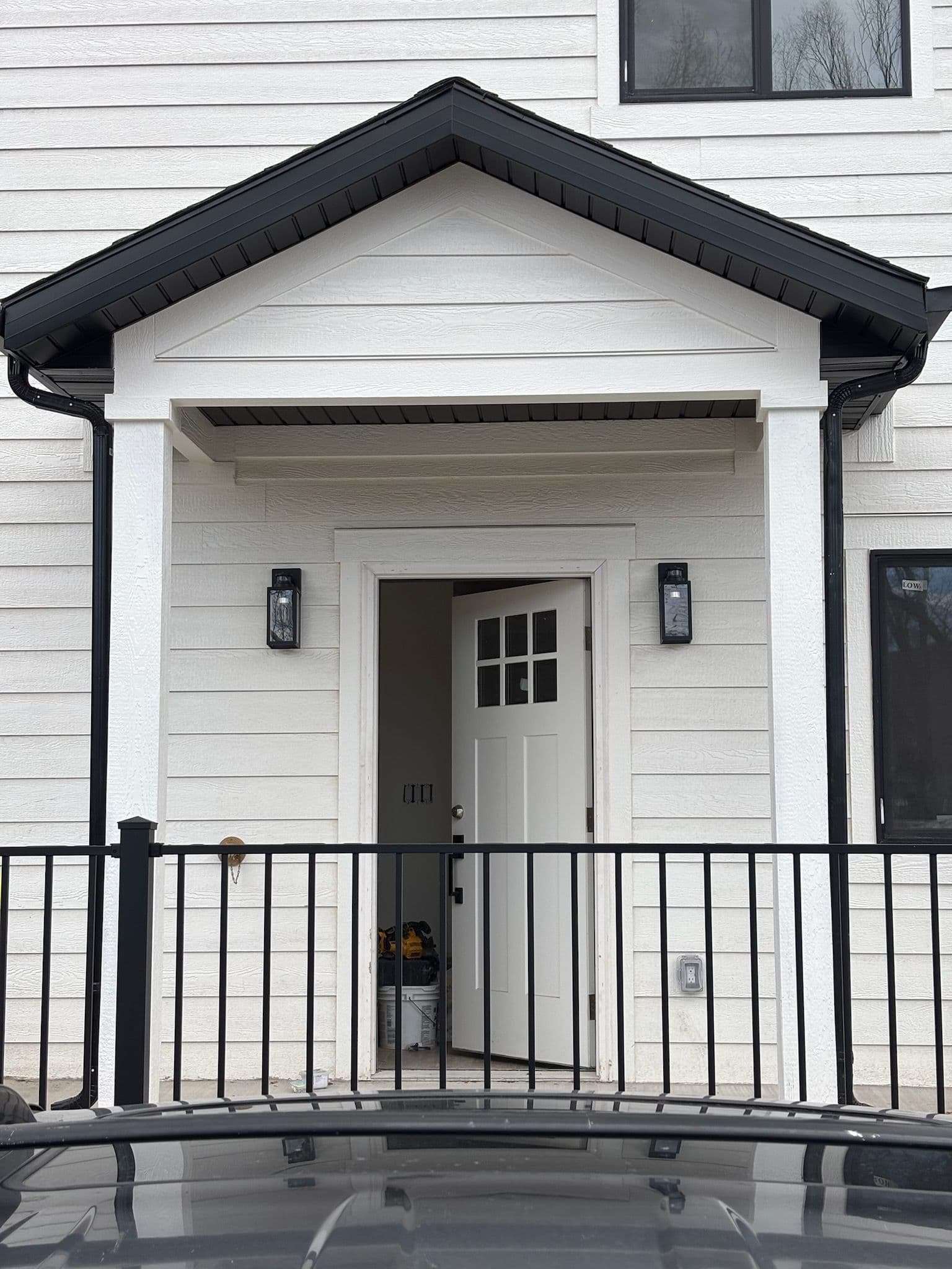 Sleek and Secure Home Entrance by Radical Homebuilders